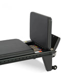 Compartiment de stockage ouvert du Reformer Pilates Studio Pro avec ressorts colorés visibles - Pilates At Home